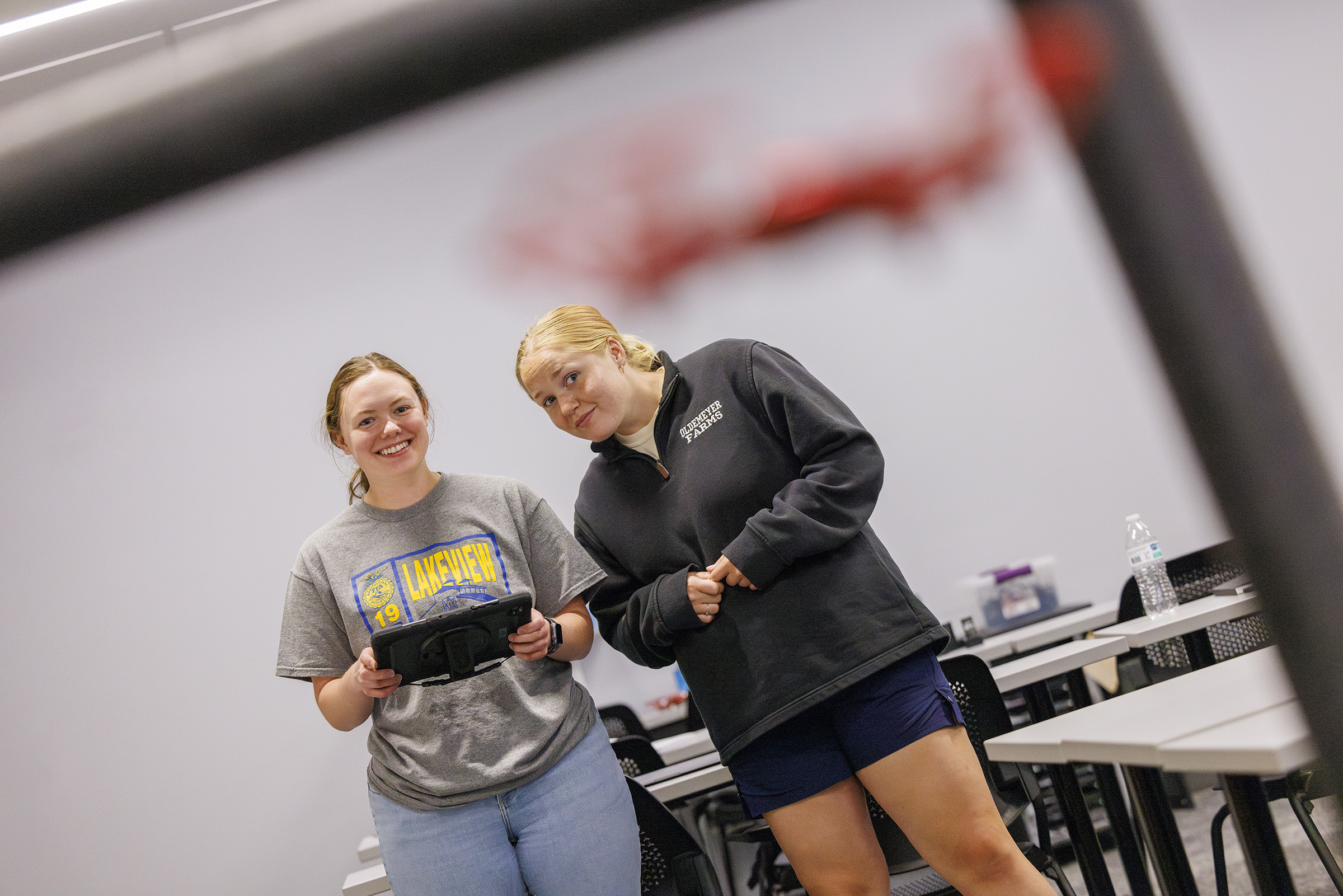 Rebecca Wulf (left), who graduated in agriculture education and will teach this fall at Lakeview Community Schools near Columbus, and Taryn Miller, a senior in agriculture education from Amherst, Nebraska, fly a drone through an obstacle course at Nebraska Innovation Studio.