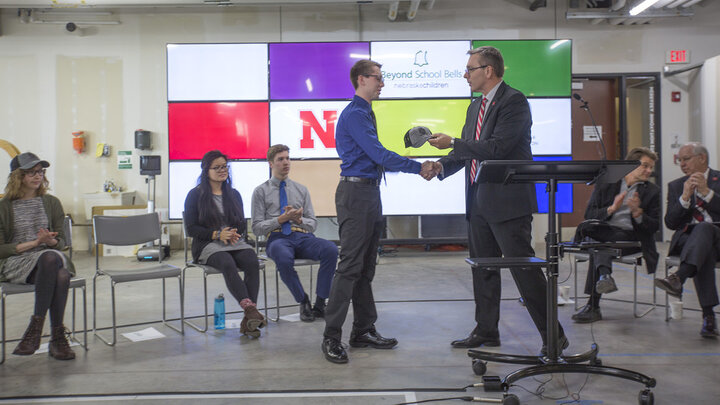 Chancellor Ronnie Green congratulates Caleb Kowalski on his selection as an inaugural Innovation Fellow Monday at Nebraska Innovation Studio. 