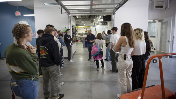 Jerry Reif (center) speaks with Bay High students outside the woodshop in Nebraska Innovation Studio on Oct. 20. 