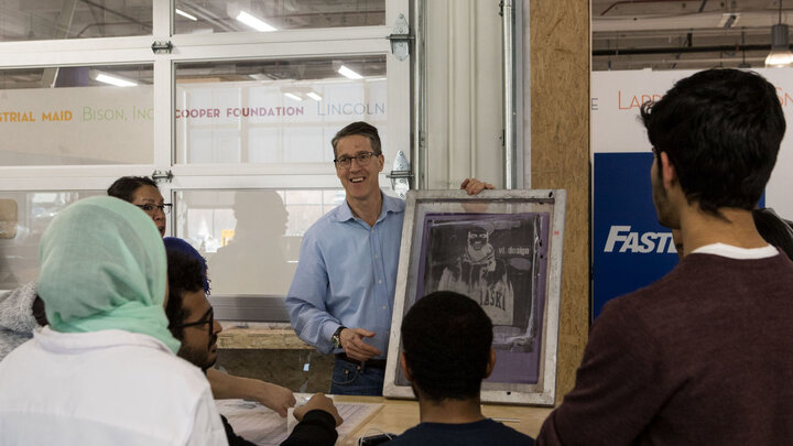 David Martin, director of Nebraska Innovation Studios, explains screen printing to students in the Intensive English Program on March 1, 2018, at Nebraska Innovation Campus in Lincoln, Nebraska.