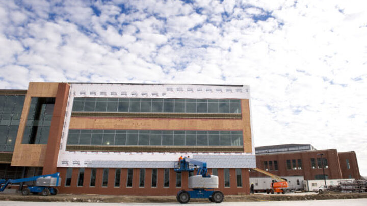 Work continues on the companion building (left) to the old 4-H building on Innovation Campus on Thursday.