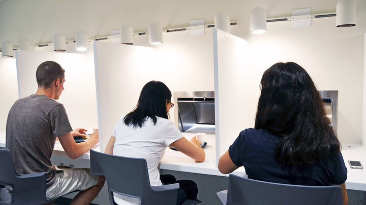 Three university community members take part in a taste test in the Sensory Analysis Lab in the Food Processing Center on Nebraska Innovation Campus. 